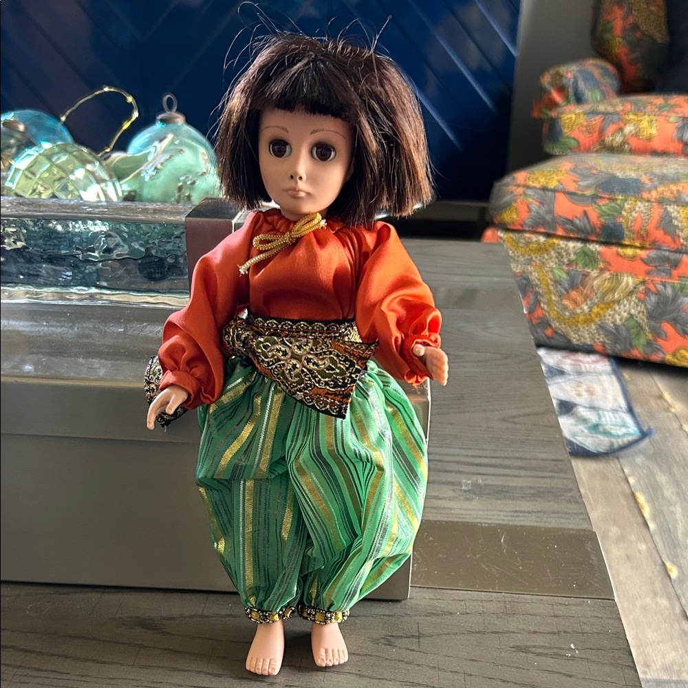 Effanbee traditional Character Kids Doll in Orange Top and Green Striped Pants.